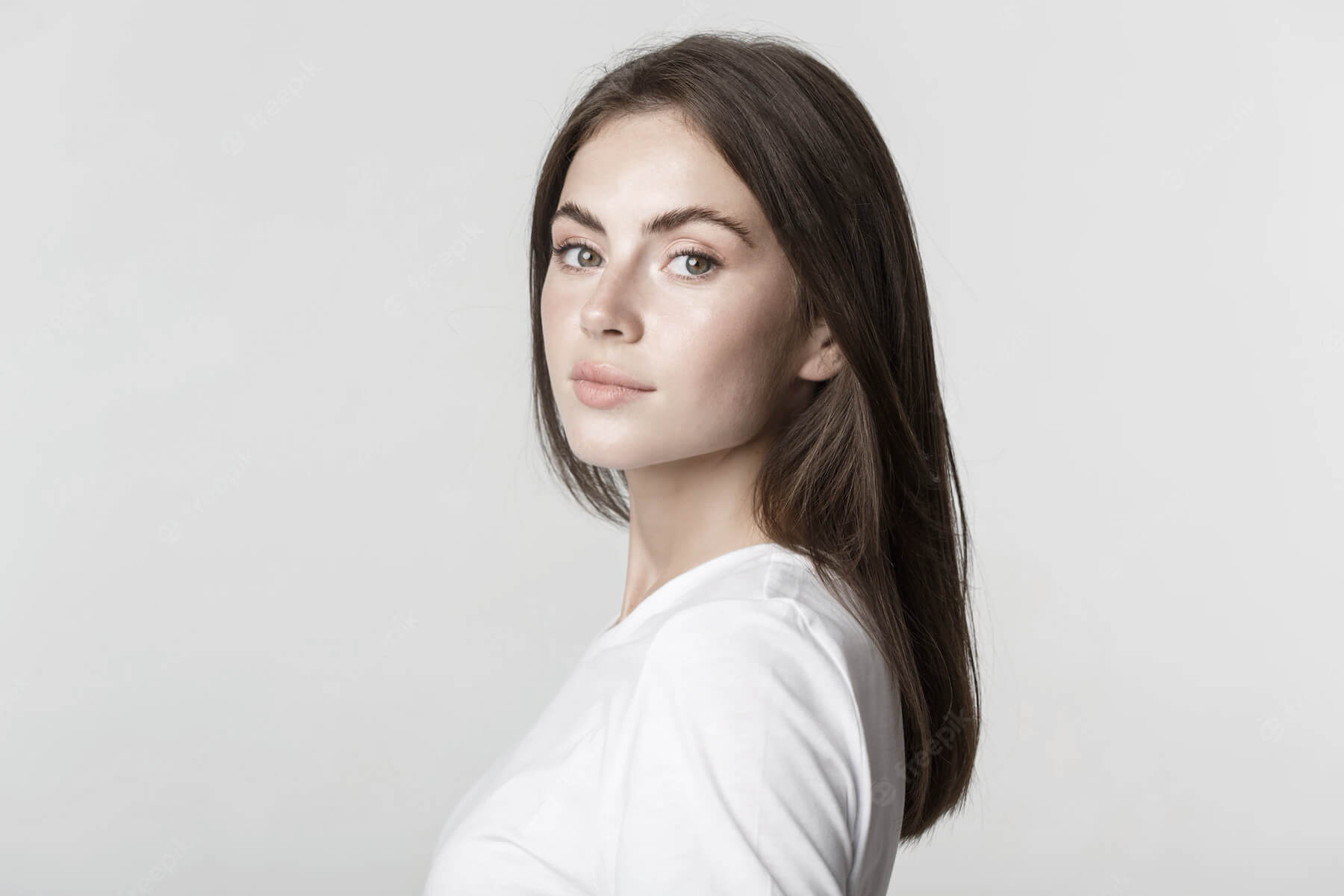 portrait confident beautiful brunette woman turning face camera with dreamy look white 1258 191442